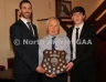 North Antrim Treasurer Chris Campbell presents the North Antrim Senior Player of Year to the joint winners Neil McManus and Saul McCaughan